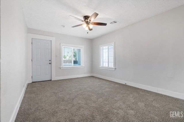 714 R St, Bakersfield, CA 93304 - empty room featuring a ceiling fan, carpet flooring, and a textured ceiling