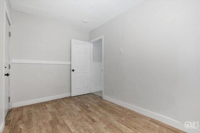714 R St, Bakersfield, CA 93304 - unfurnished room featuring light wood-style flooring and baseboards