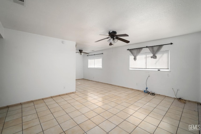 764 E Sutter Ave, Earlimart, CA 93219 - empty room with ceiling fan and a textured ceiling