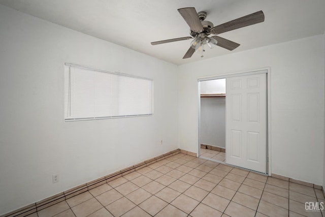 764 E Sutter Ave, Earlimart, CA 93219 - unfurnished bedroom with a closet, ceiling fan, and light tile patterned flooring