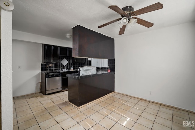 764 E Sutter Ave, Earlimart, CA 93219 - kitchen featuring stainless steel dishwasher, a peninsula, tile countertops, ceiling fan, and backsplash