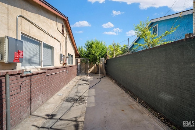 764 E Sutter Ave, Earlimart, CA 93219 - view of side of property with a gate and stucco siding