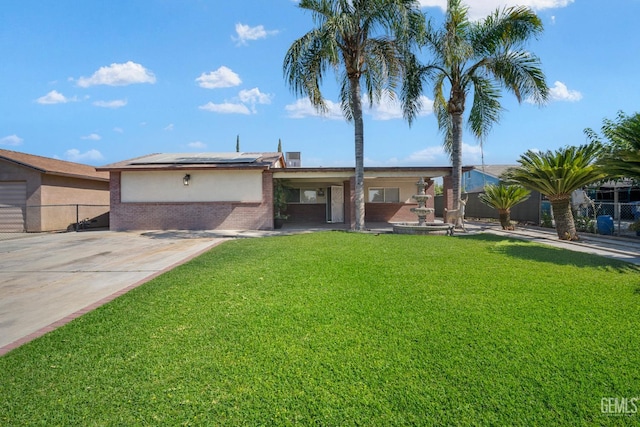 764 E Sutter Ave, Earlimart, CA 93219 - view of front of house featuring solar panels, brick siding, and stucco siding