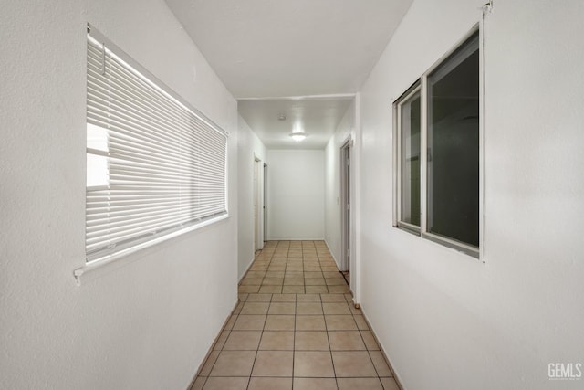 764 E Sutter Ave, Earlimart, CA 93219 - hallway featuring light tile patterned flooring