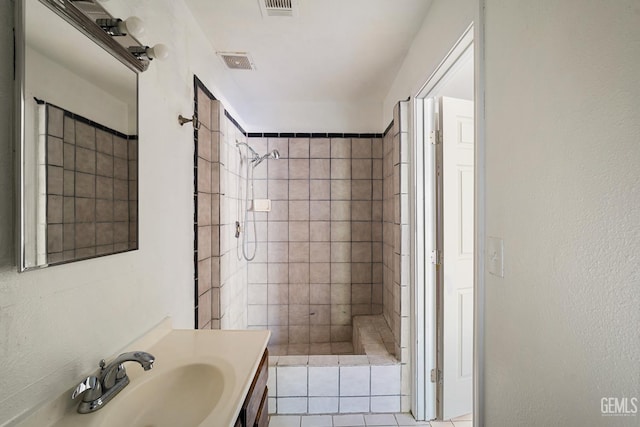 764 E Sutter Ave, Earlimart, CA 93219 - full bathroom with tiled shower, vanity, and tile patterned flooring