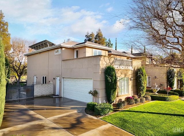 mediterranean / spanish-style home featuring a garage, concrete driveway, a balcony, and stucco siding