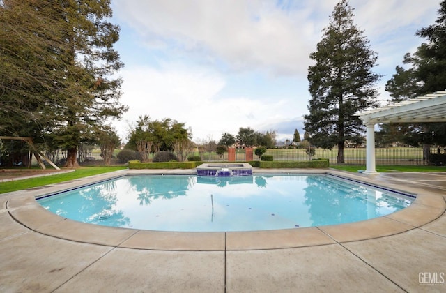 view of pool with a pool with connected hot tub