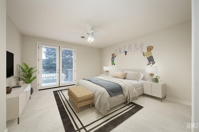 bedroom with a ceiling fan, access to outside, light carpet, and visible vents