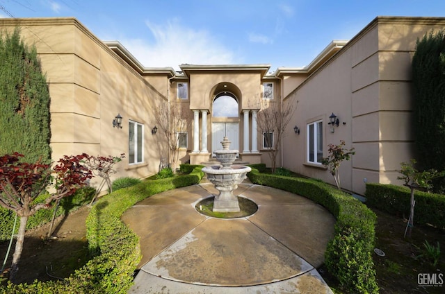 exterior space featuring stucco siding