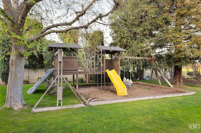 view of play area featuring a yard and fence