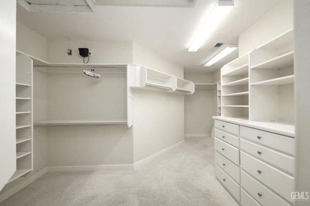 spacious closet featuring light carpet and visible vents