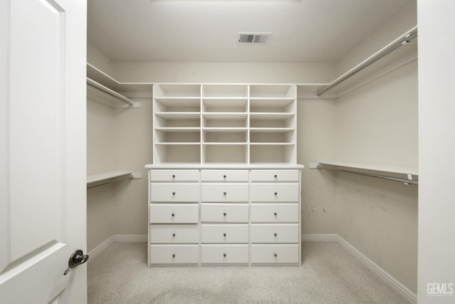 spacious closet featuring visible vents and carpet flooring