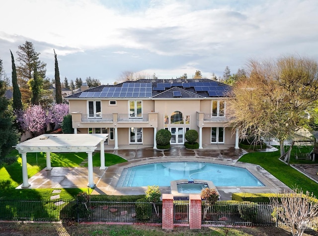 back of property featuring a patio, french doors, a fenced backyard, and a balcony