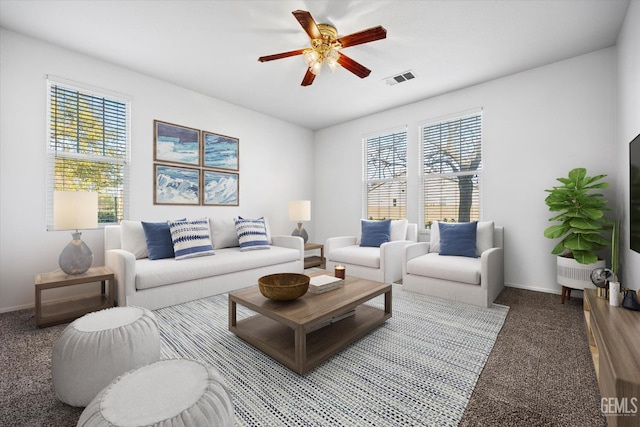 carpeted living room with ceiling fan