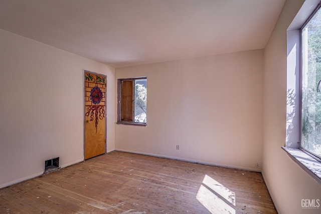 unfurnished room with light hardwood / wood-style flooring