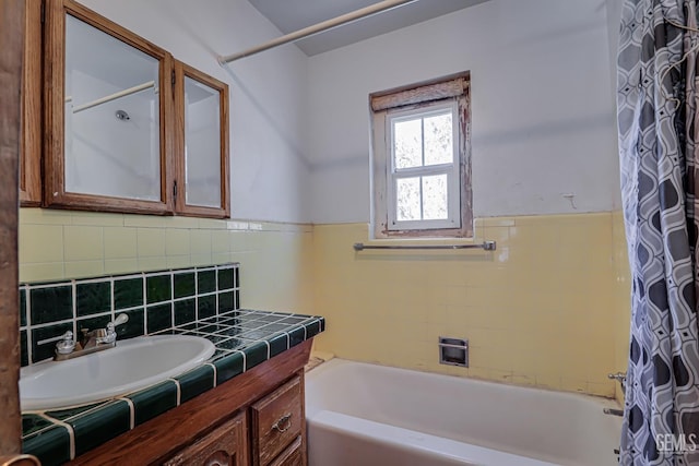 bathroom featuring vanity and shower / tub combo