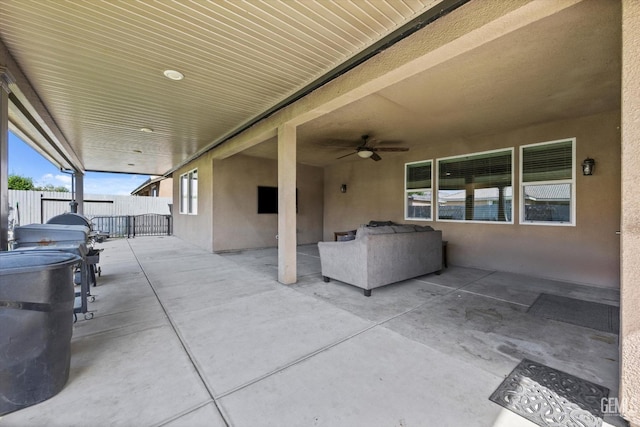 view of patio / terrace with fence and ceiling fan