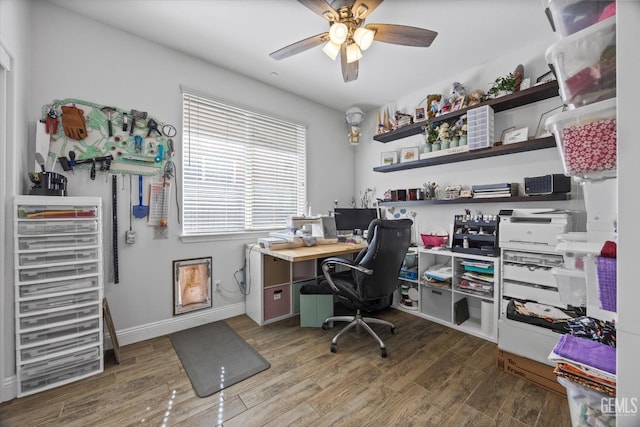 office with wood finished floors, a ceiling fan, and baseboards