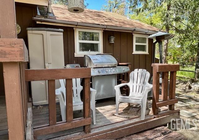 wooden deck with area for grilling