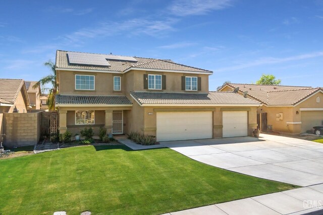 view of front facade featuring stucco siding, a front lawn, roof mounted solar panels, and a tiled roof
