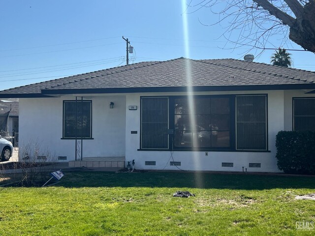 single story home featuring a front yard