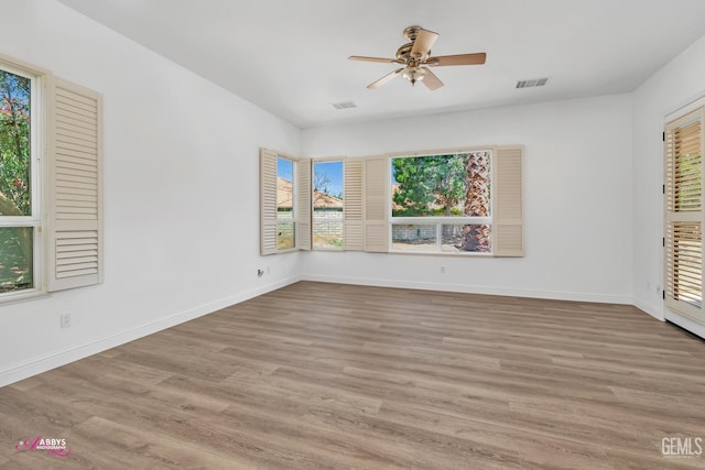 10102 Lace Cascade Ct, Bakersfield, CA 93311 - unfurnished room with healthy amount of natural light, ceiling fan, and wood finished floors