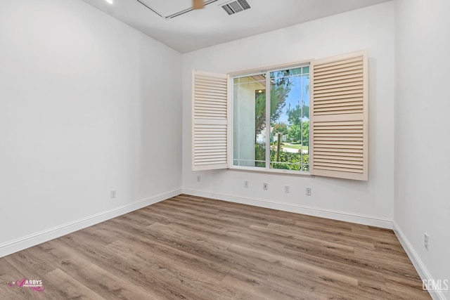 10102 Lace Cascade Ct, Bakersfield, CA 93311 - empty room featuring wood finished floors and attic access