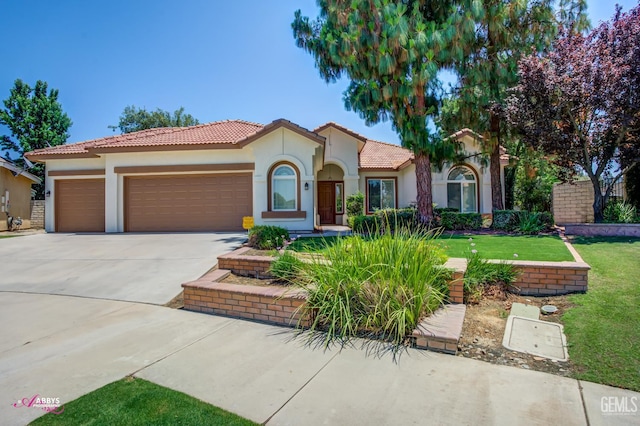 10102 Lace Cascade Ct, Bakersfield, CA 93311 - mediterranean / spanish home featuring stucco siding, an attached garage, a tile roof, concrete driveway, and a front lawn