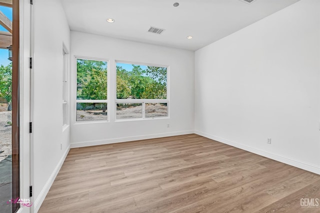 10102 Lace Cascade Ct, Bakersfield, CA 93311 - empty room with light wood-style flooring, healthy amount of natural light, and recessed lighting