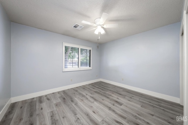 7408 Dos Rios Way, Bakersfield, CA 93309 - spare room featuring wood finished floors, baseboards, visible vents, a ceiling fan, and a textured ceiling