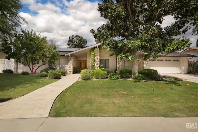 7408 Dos Rios Way, Bakersfield, CA 93309 - view of front of home featuring stucco siding, solar panels, a front lawn, and stone siding