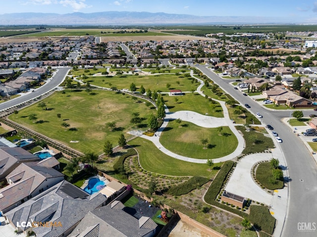 9404 Red Rock Creek Way, Bakersfield, CA 93311 - aerial overview of property's location featuring mountains, nearby suburban area, and a pool area