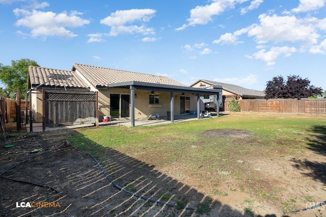 9404 Red Rock Creek Way, Bakersfield, CA 93311 - back of property with ceiling fan, stucco siding, a patio, and a tile roof