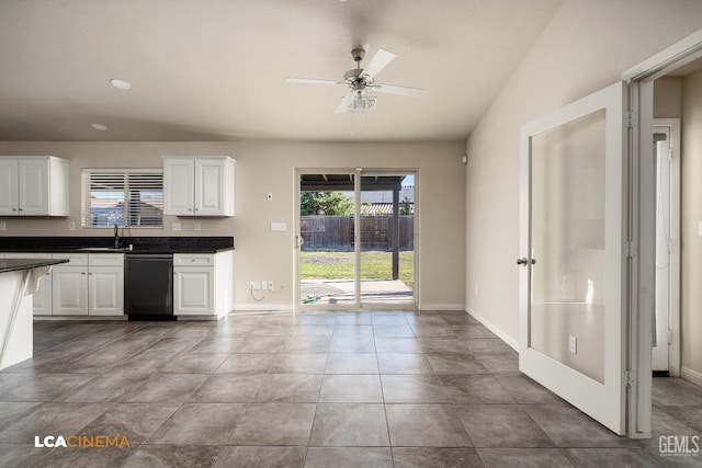 9404 Red Rock Creek Way, Bakersfield, CA 93311 - kitchen with dishwashing machine, a sink, dark countertops, white cabinets, and a ceiling fan