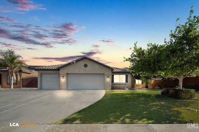 9404 Red Rock Creek Way, Bakersfield, CA 93311 - view of front of house with a garage, a tile roof, stucco siding, and driveway