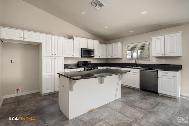 9404 Red Rock Creek Way, Bakersfield, CA 93311 - kitchen featuring appliances with stainless steel finishes, a sink, vaulted ceiling, a kitchen island, and white cabinets