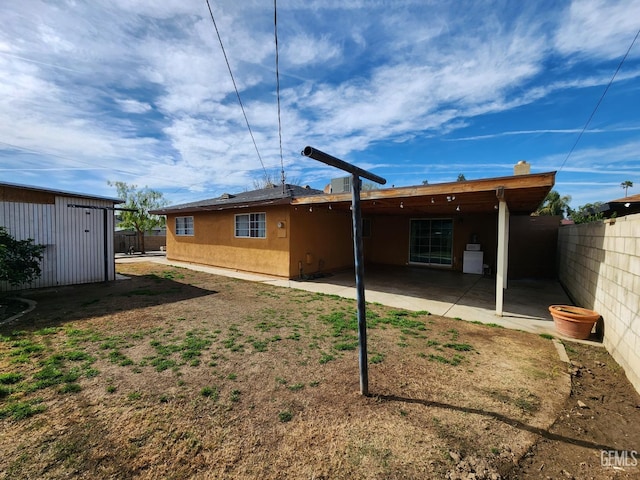 rear view of house with a patio