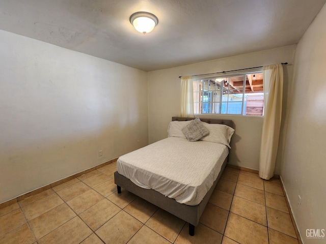 bedroom featuring light tile patterned floors