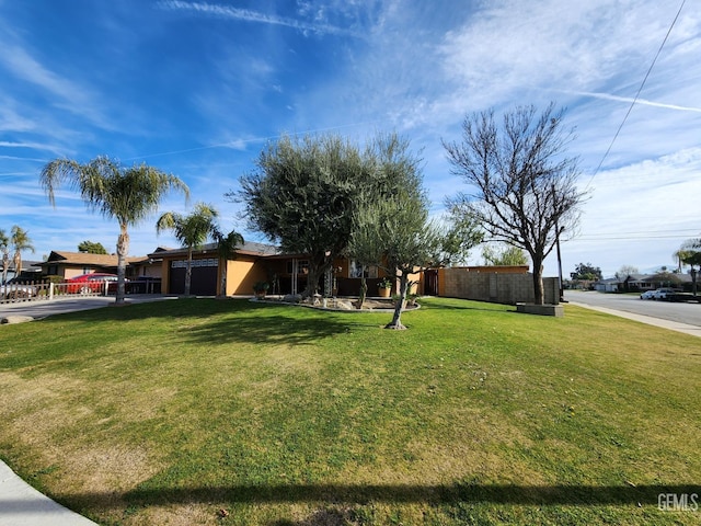 view of yard with a garage