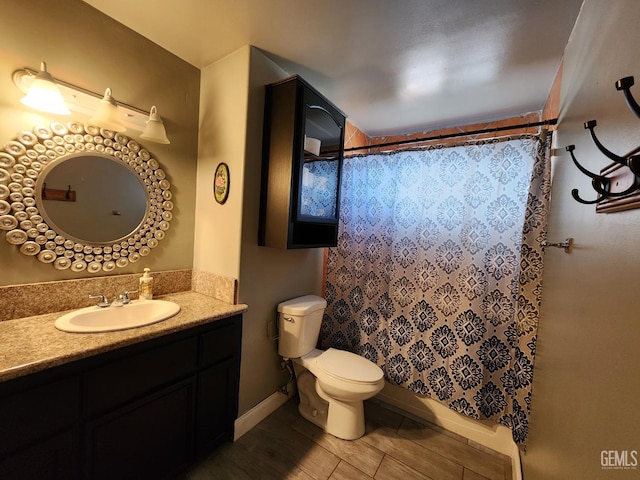 bathroom featuring vanity, toilet, and a shower with shower curtain