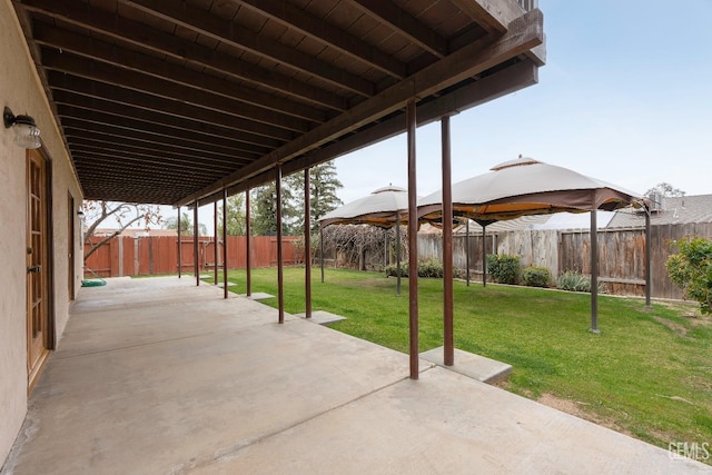 view of patio featuring a gazebo and a fenced backyard