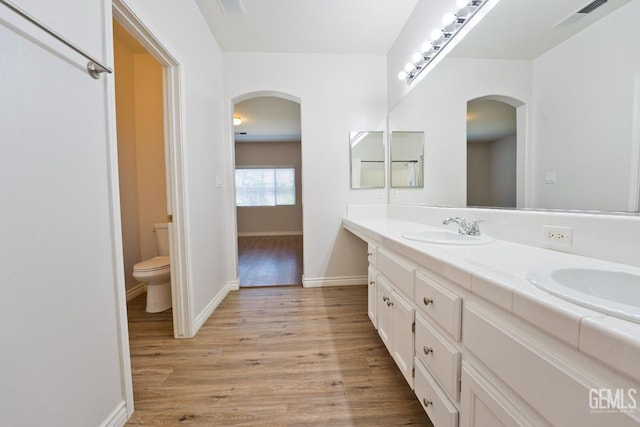 6720 Alderbrook Ln, Bakersfield, CA 93312 - bathroom featuring wood finished floors and double vanity