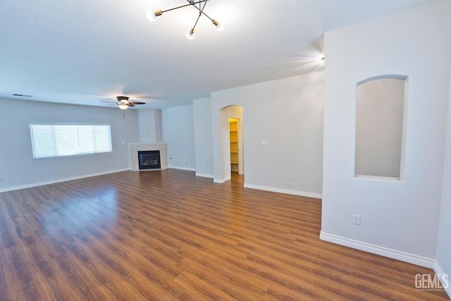 6720 Alderbrook Ln, Bakersfield, CA 93312 - unfurnished living room with arched walkways, ceiling fan, wood finished floors, and baseboards