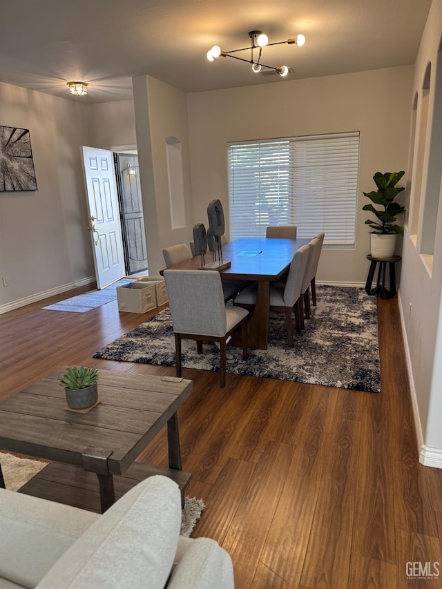 6720 Alderbrook Ln, Bakersfield, CA 93312 - dining room featuring a chandelier and wood finished floors