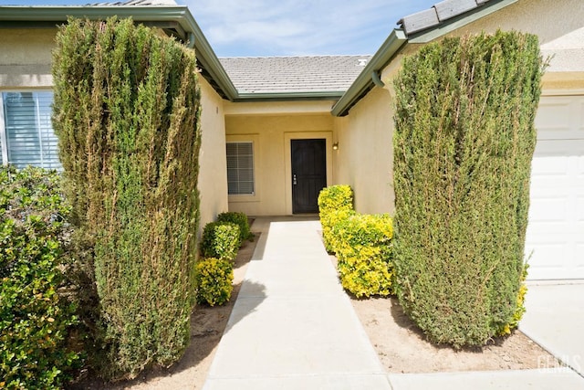 6720 Alderbrook Ln, Bakersfield, CA 93312 - property entrance featuring stucco siding and an attached garage