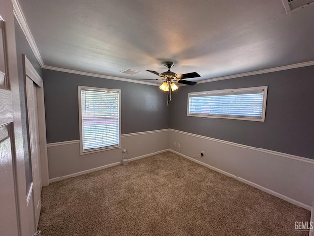 4049 Liz Dr, Bakersfield, CA 93312 - spare room featuring carpet, crown molding, and a ceiling fan
