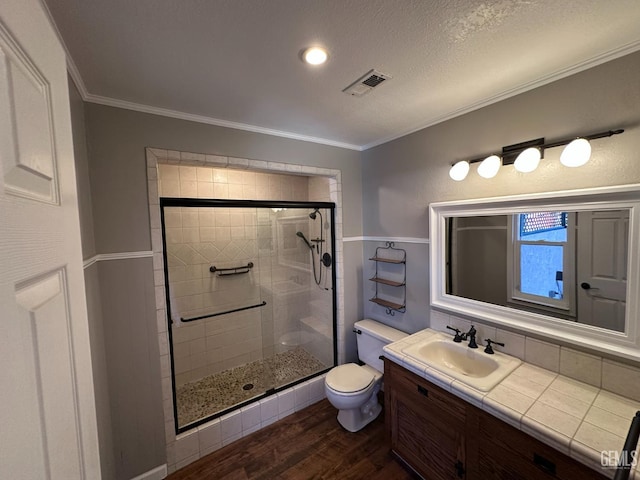 4049 Liz Dr, Bakersfield, CA 93312 - full bathroom featuring a shower stall, wood finished floors, vanity, and crown molding