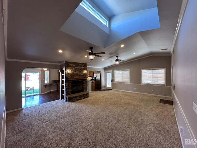 4049 Liz Dr, Bakersfield, CA 93312 - unfurnished living room with carpet, arched walkways, lofted ceiling, a ceiling fan, and healthy amount of natural light