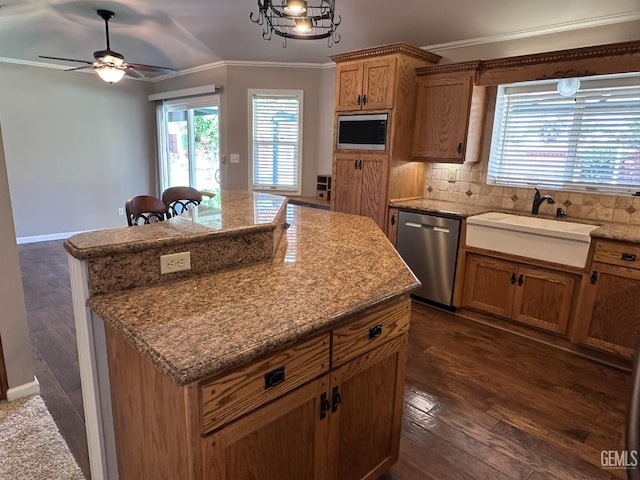 4049 Liz Dr, Bakersfield, CA 93312 - kitchen featuring stainless steel dishwasher, ornamental molding, a kitchen island, dark wood-style flooring, and a ceiling fan