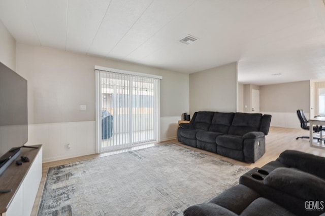4401 Hughes Ln Unit 148, Bakersfield, CA 93304 - living room with a wainscoted wall and wood finished floors
